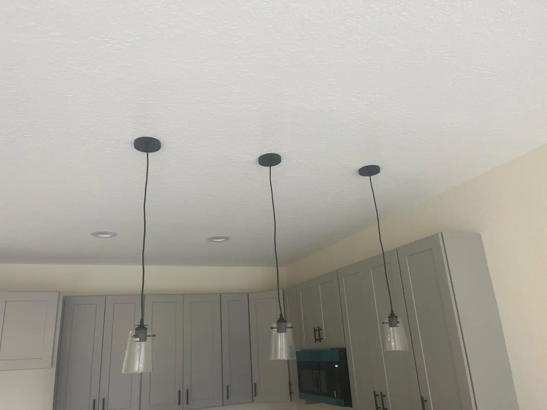 Hanging lights over the kitchen island