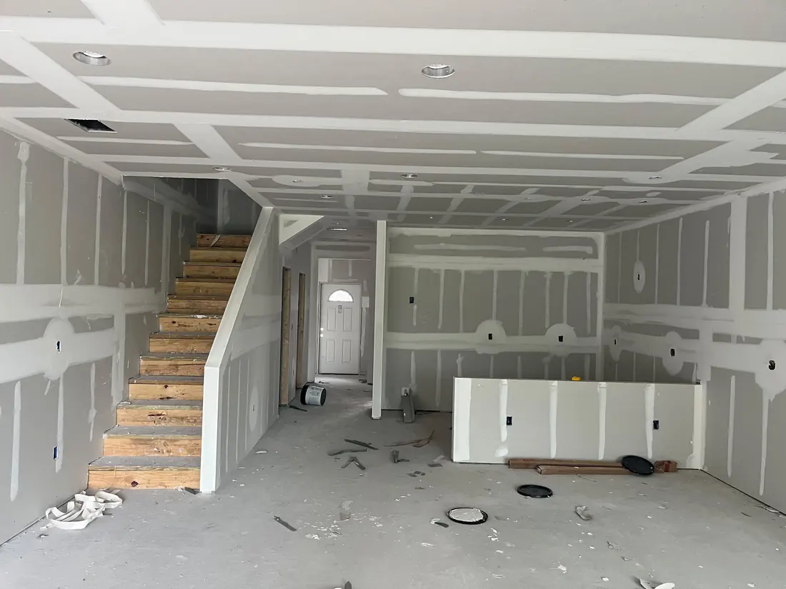Before: bare drywall walls, unpainted