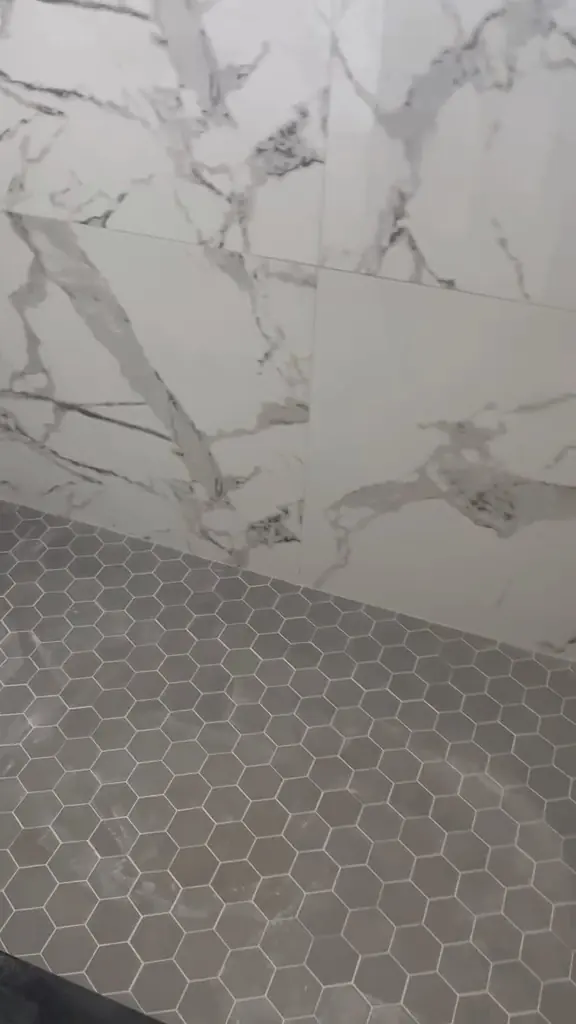 Shower floor sloped to the drain