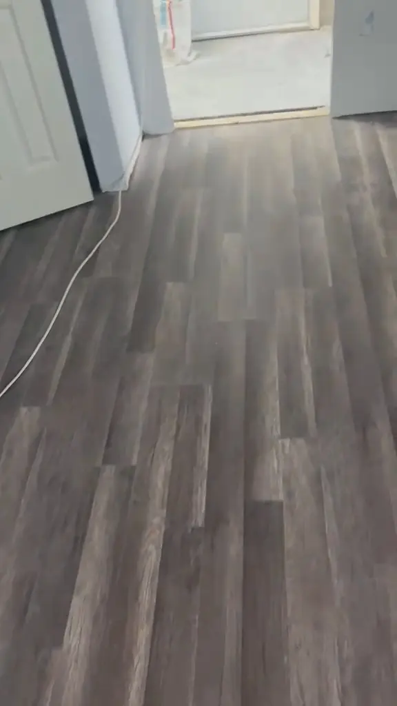 Gray plank floor, wall to wall